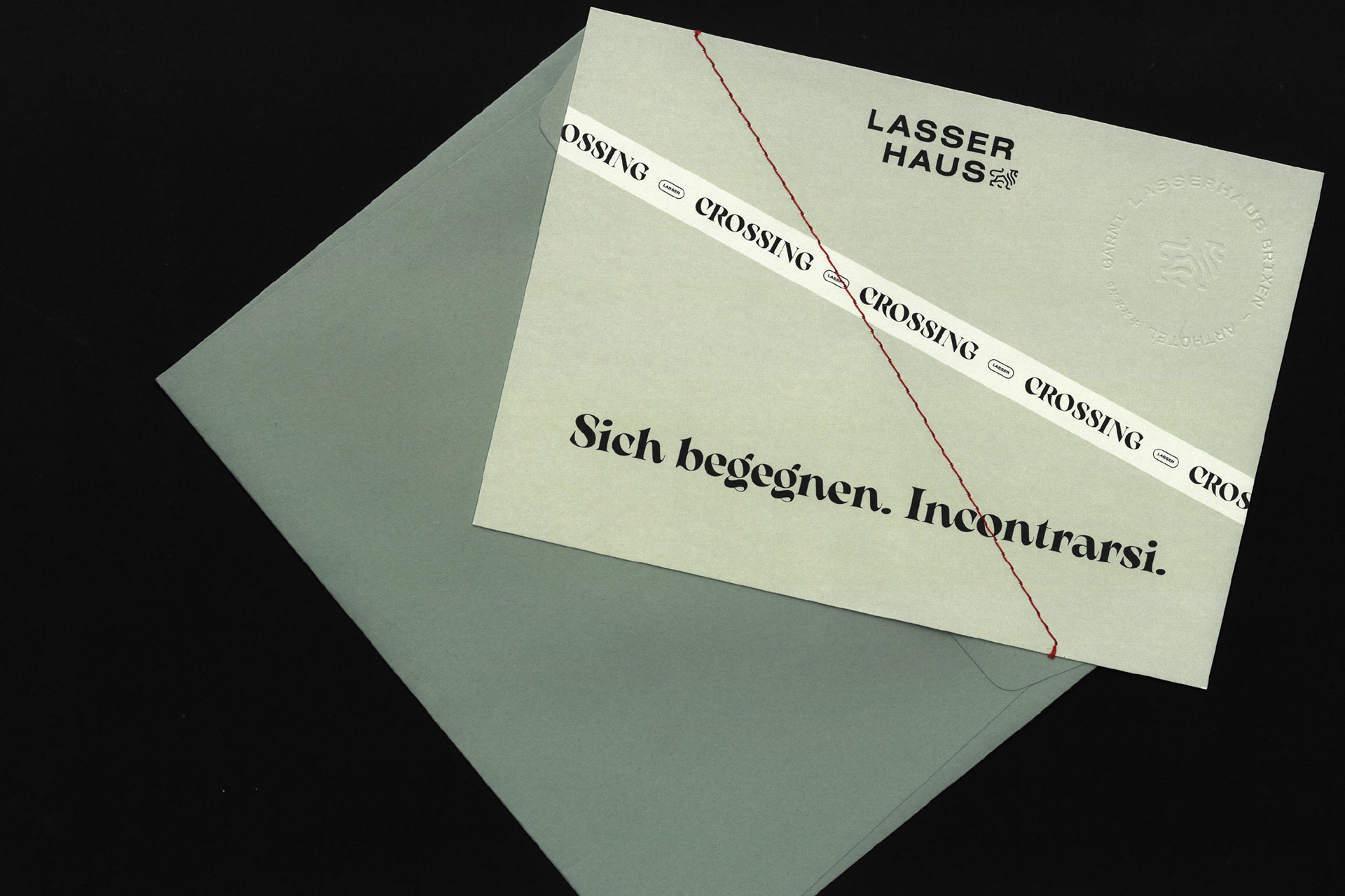 Einladungskarte mit Text: 'Sich begegnen. Incontrarsi.' und 'Lasserhaus' Logo.