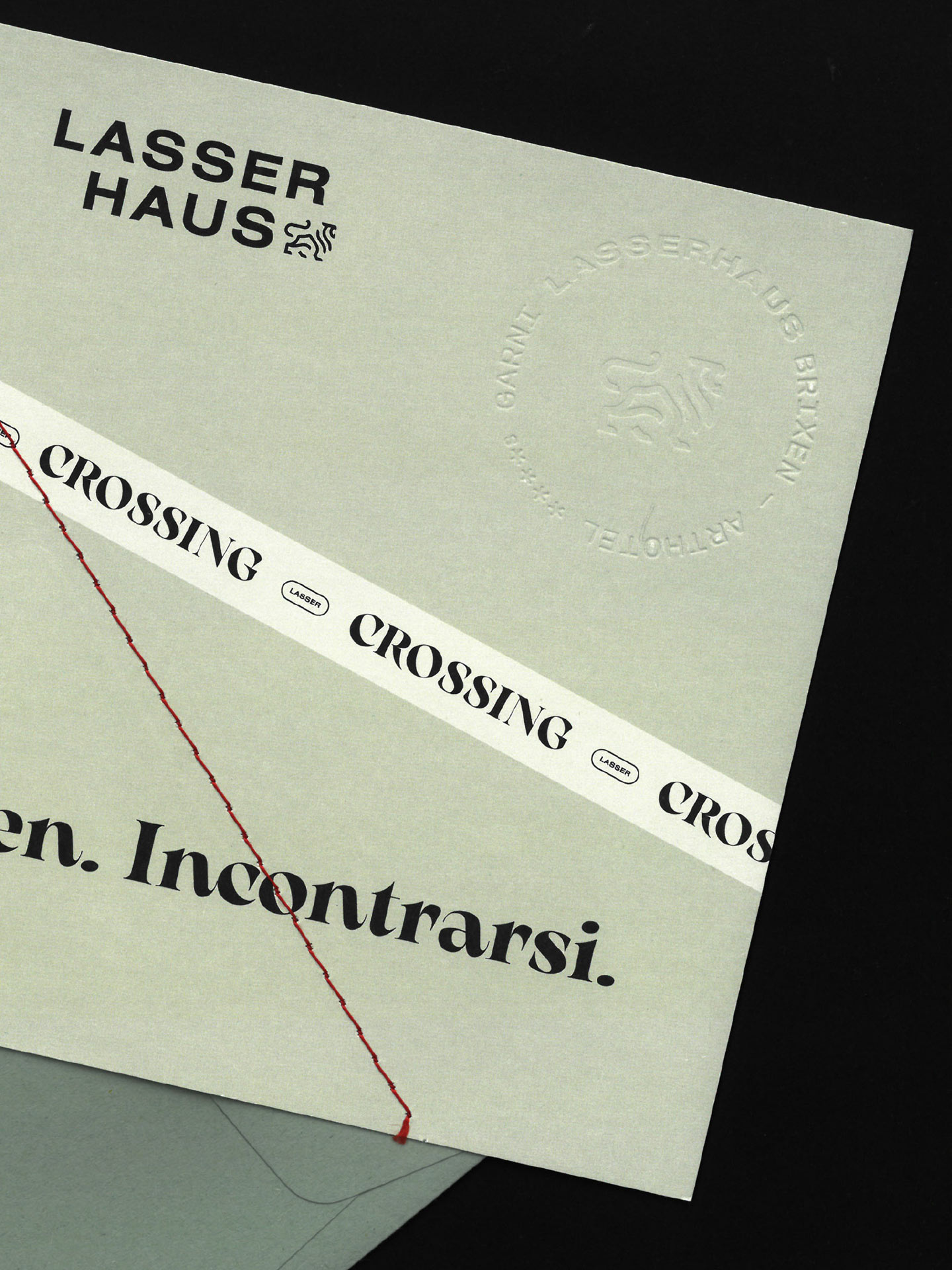 Details einer Premium-Marketingkarte mit Lasserhaus-Logo und Text 'Crossing'.